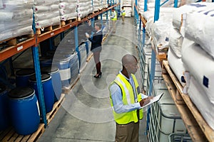 Warehouse staff checking stocks in warehouse