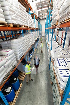 Warehouse staff checking stocks in warehouse