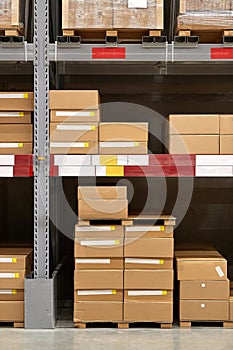 Warehouse stocked with boxes in stacks