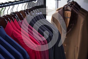 A warehouse,store photo of lot shirts, multicolour,shop fashion men clothes.