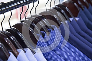 A warehouse,store photo of lot shirts , multicolour,shop fashion men clothes.