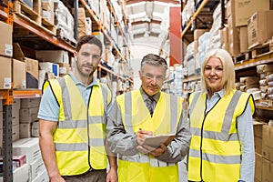 Warehouse team smiling at camera