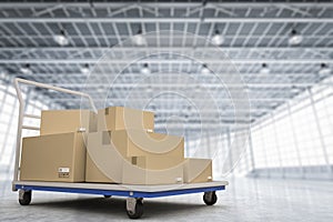 Warehouse trolley with heap of storage boxes