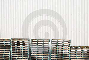 Warehouse wall with wooden palet background ready for product display montage