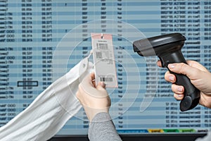 A warehouse woman employee accepts cargo, goods using barcode scanner reading a bar code from and adds to the computer base. photo