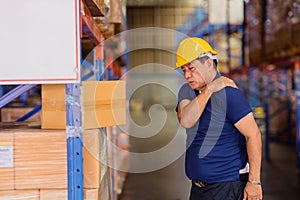 Warehouse worker back shoulder muscle pain injuries from heavy lifting hard working