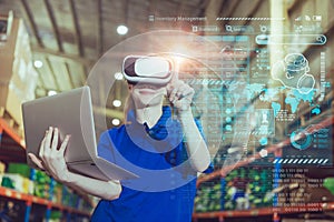 warehouse worker enjoy using advance modern technology VR overlay digital data infographics interface monitor tracking cargo