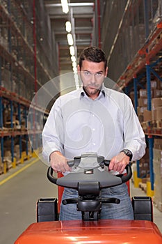 Warehouse worker on forklift