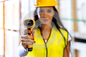 Warehouse worker hold inventory scanner