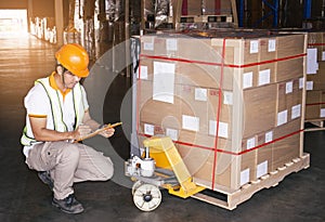 Warehouse worker holding clipboard his doing inventory management cargo shipment pallet. Checking stock, Packaging, Cargo shipment