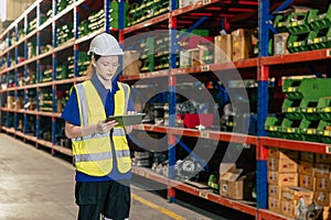 warehouse worker. inventory clerk staff stock employee work in cargo storage shelf managed checking shipping order using tablet