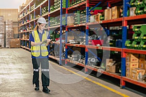 warehouse worker. inventory clerk staff stock employee work in cargo storage shelf managed checking shipping order using tablet