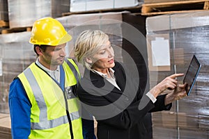 Warehouse worker and manager using tablet pc