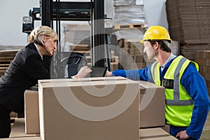 Warehouse worker and manager using tablet pc