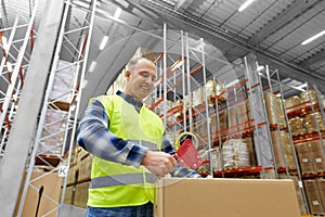 Warehouse worker packing parcel with scotch tape