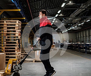 Warehouse worker with a pallet rack