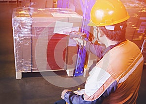 Warehouse Worker Scanning Bar Code Scanner on Package Boxes. Computer Work Tools for Warehouse Inventory Management.