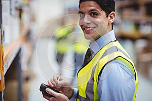 Warehouse worker using hand scanner