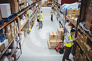 Warehouse worker using hand scanner