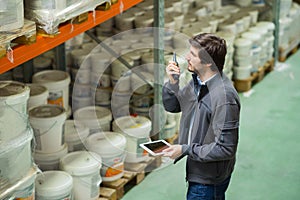 warehouse worker using walkie talkie