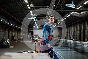 Warehouse worker working on a conveyor line