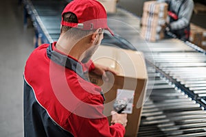 Warehouse worker working on a conveyor line