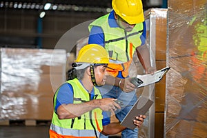 Warehouse workers with bar code scanner checking inventory, Forman worker scanning boxes in warehouse rack, Workers working in