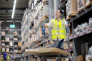 Warehouse workers Check stock details in storage area putting them on shelves. work in distribution center