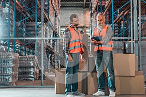 warehouse workers with clipboard
