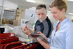 Warehouse workers counting stock