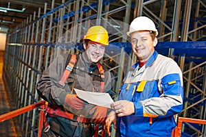 warehouse workers engineers in new modern storehouse
