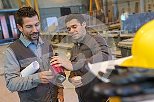 Warehouse workers having break with coffee