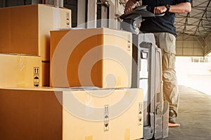 Warehouse Workers Loading a Package Boxes at Warehouse. Shipment, Supply Chain, Supplies Warehouse Logistics.