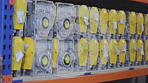 Warehouse with yellow gearboxes, warehouse for the production of gear motors, gear motors in the warehouse