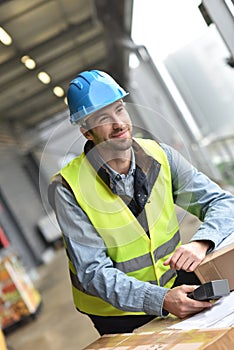Warehouseman scanning merchandise