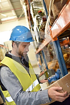 Warehouseman scanning merchandise