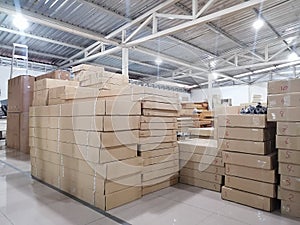 Warehouses that store goods which are packed in cardboard boxes and stack them together ready for delivery
