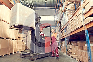 Warehousing and storage. warehouse workers works with forklift loader