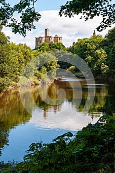 Warkworth Castle reflected in the River Coquet, Morpeth, Northumberland, UK photo