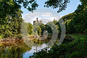Warkworth Castle and the River Coquet in Morpeth, Northumberland, UK on a sunny day