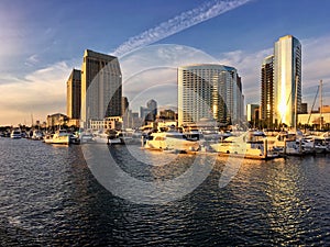 Warm afternoon light on city skyline and boat Marina, San Diego, California, USA