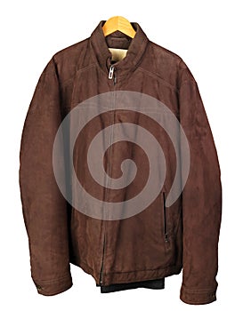 A warm autumn corduroy jacket  brown jacket of my grandfather hangs on a hanger isolated