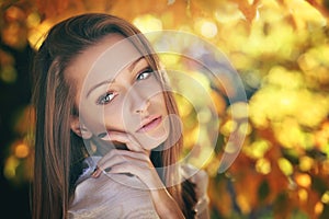 Warm autumn portrait of a young woman