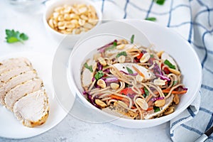 Warm backwheat pasta chicken vegetables salad with peanuts
