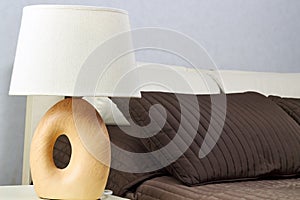 Warm bedroom with a lamp on a night table