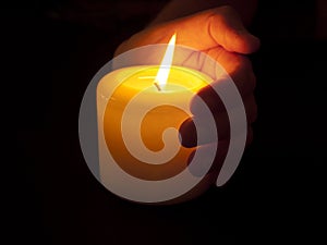 Warm Candle in Cupped Hand