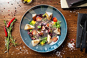 Warm chicken liver salad with port wine-honey sauce. Carrot cream, bacon, cherry tomatoes, brioche. Delicious healthy