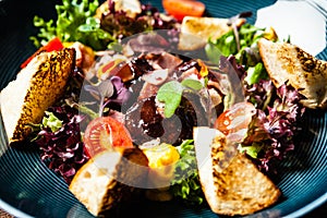 Warm chicken liver salad with port wine-honey sauce. Carrot cream, bacon, cherry tomatoes, brioche. Delicious healthy