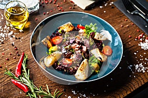 Warm chicken liver salad with port wine-honey sauce. Carrot cream, bacon, cherry tomatoes, brioche. Delicious healthy