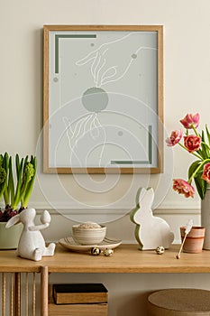 Warm composition of easter living room interior with mock up poster frame, wooden sideboard, vase with tulips, easter bunny,